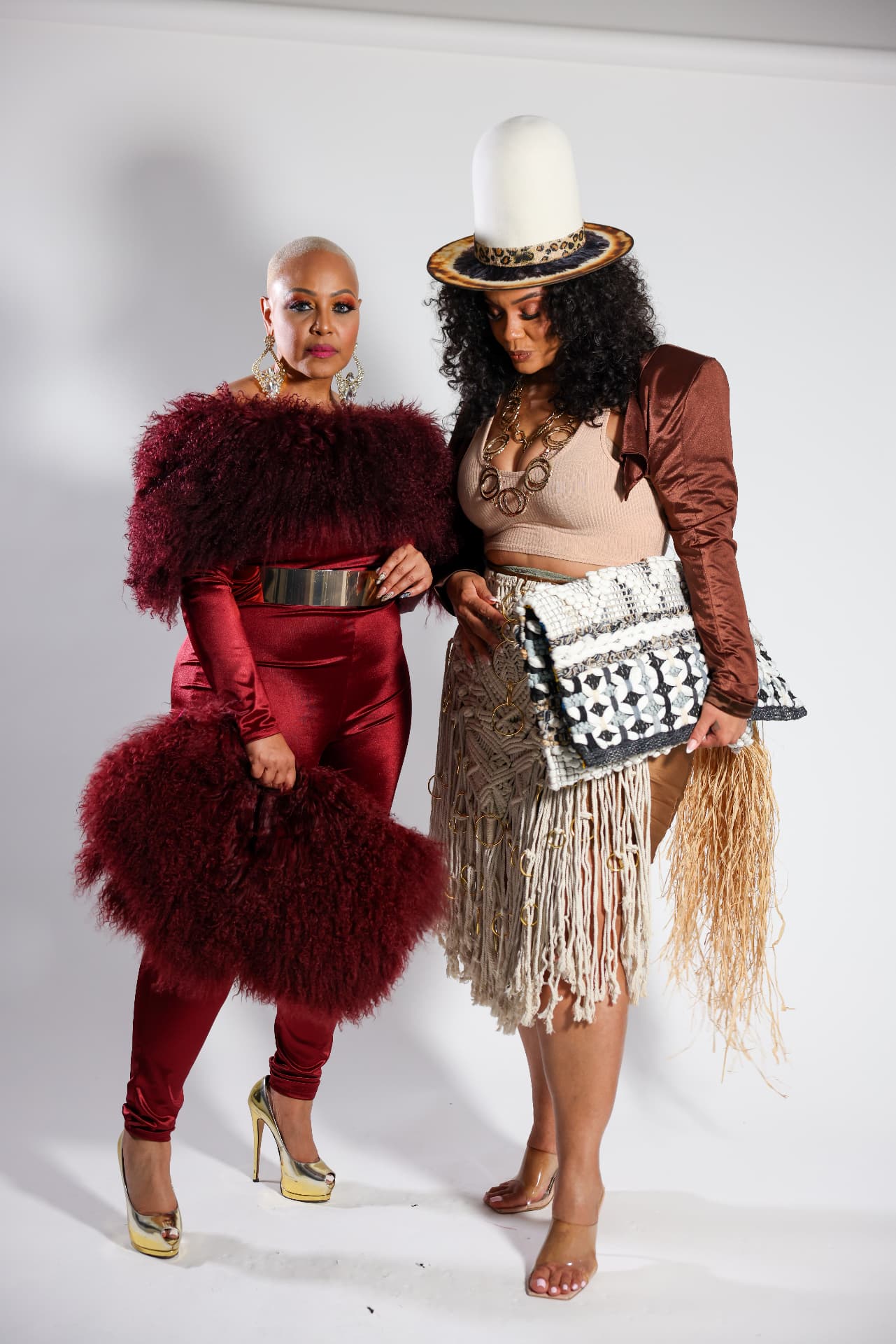 Two guests in statement fur and fringe looks