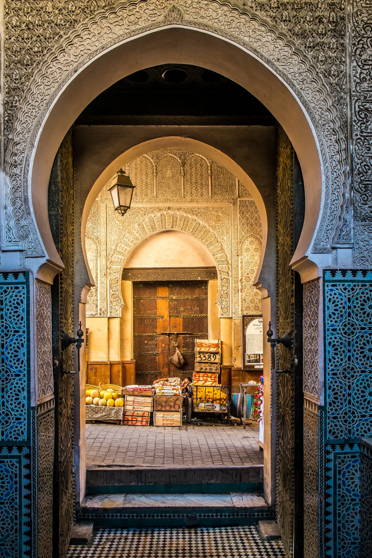 Ornate Moroccan archway opening onto an open-air market