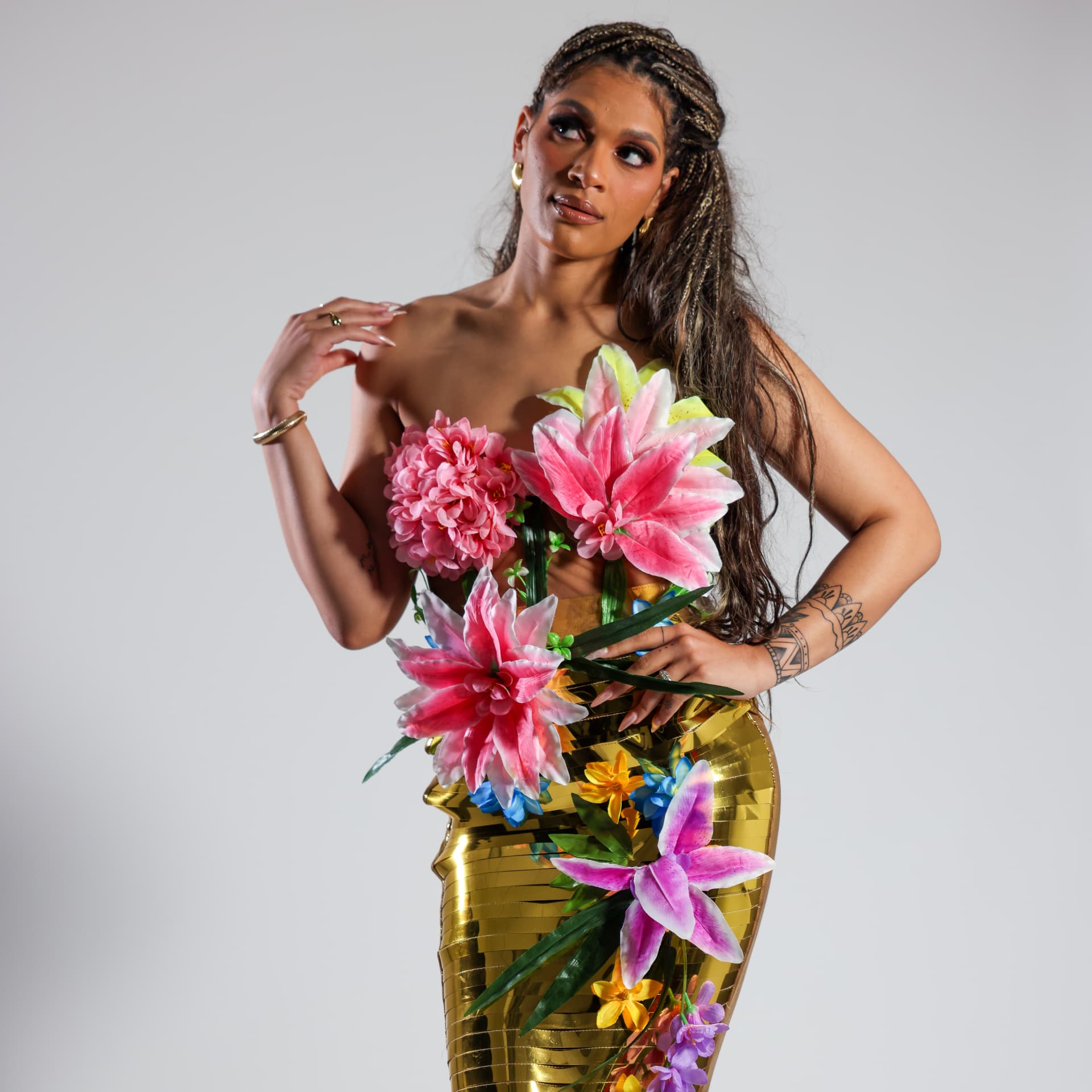 Model in a gold floral gown