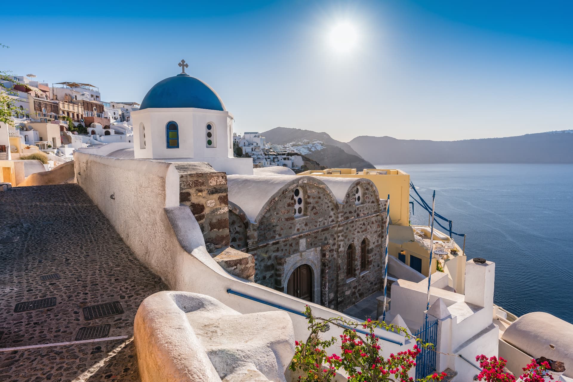 Blue-domed orthodox church above the Santorini caldera