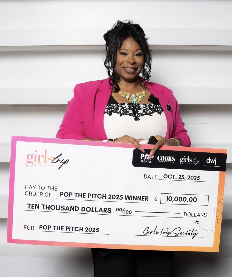 Megan Amos of Lifestyle Nails Mobile Spa holding the $10,000 Pop the Pitch 2025 winner check